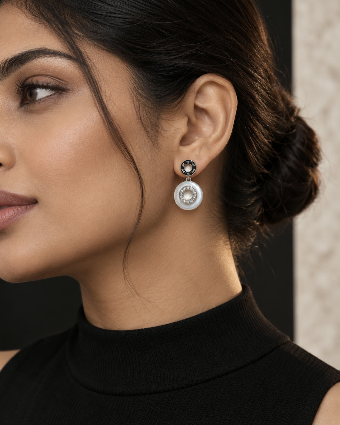 Mother-of-pearl double halo drop earrings seen in profile