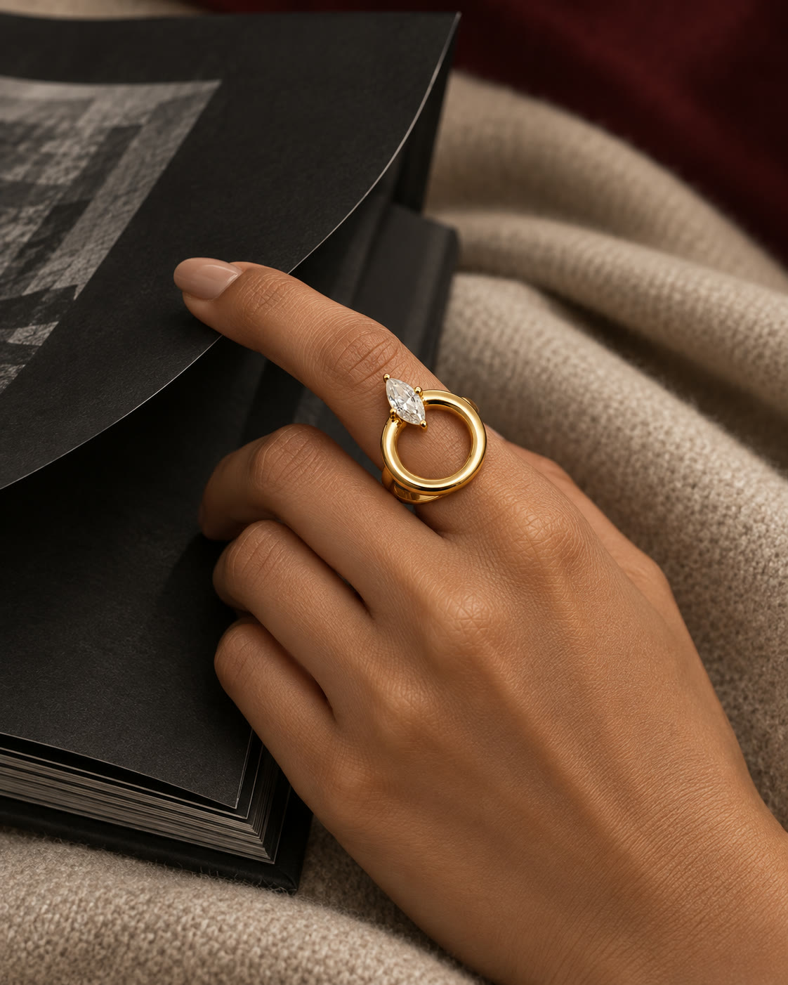 A halo marquise adjustable ring worn on the hand